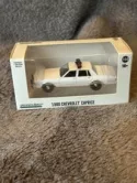1980-90 Chevrolet Caprice White w/ Lights 1:64 Scale Model - Greenlight 43005