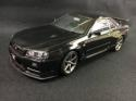 77407 AutoArt Composite 1 18 Nissan Skyline GT R (R34) V spec II Black Pearl